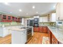 Modern kitchen featuring stainless steel appliances, granite countertops, and custom cabinetry at 128 Causey St., Myrtle Beach, SC 29577