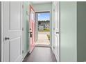 View from entryway showing an open doorway and natural light and access to other rooms at 136 Villa Grande St. # B, Myrtle Beach, SC 29579