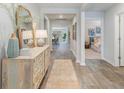 Inviting entryway with wood flooring, decorative cabinet, and views into other rooms at 152 Ashworth Dr., Tabor City, NC 28463