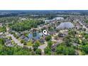 Stunning aerial view of community, showcasing lake, trees, and single-Gathering homes at 162 Jessica Lakes Dr., Conway, SC 29526