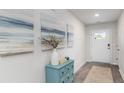 Inviting entryway featuring stylish decor, a blue console table, neutral walls, and durable flooring at 177 Ashworth Dr., Tabor City, NC 28463