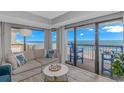 Bright living room features a comfortable sectional, seaside decor and ocean view balcony access at 200 72Nd Ave. N # 501, Myrtle Beach, SC 29572