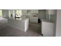 Kitchen with white cabinets and island, offering a sleek and modern design at 2212 Dykman Circle, Little River, SC 29566