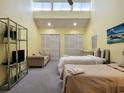Spacious bedroom featuring two beds, ample closet space, and lofted ceilings at 223 Maison Dr. # D-16, Myrtle Beach, SC 29572
