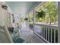 Spacious front porch features rocking chairs and ample room for relaxing at 228 Hopeland St., Pawleys Island, SC 29585