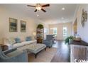 Inviting living room featuring neutral tones, stylish decor, and an open floor plan to dining area at 2800 Cook Circle # B, Myrtle Beach, SC 29577