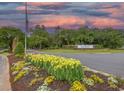Welcoming entrance to a prestigious community, featuring beautiful landscaping and an elegant sign at 307 Golden Bear Dr. # 3, Pawleys Island, SC 29585