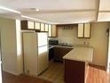Traditional kitchen featuring white appliances and plenty of cabinets, providing ample storage space at 500 Fairway Village Dr. # 6E, Myrtle Beach, SC 29588