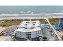 Aerial view of condo building near the beach, showcasing the rooftop HVAC units and surrounding area at 5000 N Ocean Blvd. # F2, North Myrtle Beach, SC 29582