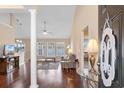Inviting entryway showcasing wood floors, a decorative column, and a view of the living area at 509 Fallen Leaf Ct., Myrtle Beach, SC 29588