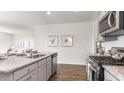 Modern kitchen featuring stainless steel appliances, granite countertops, and wood flooring at 5140 Yellowstone Dr., Conway, SC 29526