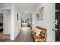 Inviting entryway featuring wood-look tile flooring and a stylish bench at 5153 Yellowstone Dr., Conway, SC 29526