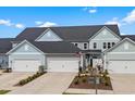 Attractive townhomes offer attached garages and lovely landscaping for a welcoming curb appeal at 5371 Knobcone Loop # D, Myrtle Beach, SC 29577