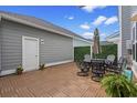Cozy outdoor patio with a dining set, privacy fence, and stylish flooring at 5371 Knobcone Loop # D, Myrtle Beach, SC 29577