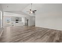 Open floor plan with view of the kitchen featuring modern gray cabinets at 609 Carter Reid Ct., Longs, SC 29568