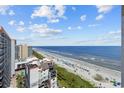 Expansive beach view from a condo overlooking the ocean, showcasing the sandy shoreline and blue waters at 7100 Ocean Blvd. N # 1425, Myrtle Beach, SC 29572