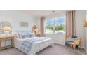 Comfortable bedroom with wallpaper, a large window for natural light, and stylish décor at 719 Chazen Way, Longs, SC 29568