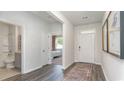 Inviting entryway featuring hardwood floors, a guest bathroom and a bedroom at 719 Chazen Way, Longs, SC 29568