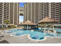 Expansive outdoor pool area featuring a swim up bar and luxury resort style seating at 820 Madiera Dr. # 14, North Myrtle Beach, SC 29582