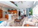 Cozy living room featuring an open floor plan, breakfast bar, and stylish furnishings at 912 Berwick Ln., Myrtle Beach, SC 29579