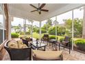 Screened porch with comfortable wicker furniture, perfect for outdoor relaxation and entertaining at 912 Berwick Ln., Myrtle Beach, SC 29579