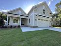 Beautiful exterior view of a craftsman style home showcasing a large two-car garage and covered porch at 924 Morrall Dr., North Myrtle Beach, SC 29582