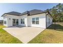 Spacious backyard showcasing a concrete patio, perfect for outdoor entertaining and relaxation at Simpson Creek Dr., Loris, SC 29569