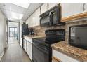 Functional kitchen includes essential appliances, granite countertops, and ample cabinet space for convenient meal preparation at 1501 South Ocean Blvd. # 643, Myrtle Beach, SC 29577