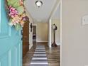 Inviting entryway features fresh floors, neutral walls, and a glimpse into the home's stylish interior at 153 Busbee St., Conway, SC 29526