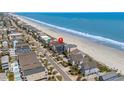 A birdseye view showcases a coastal property near the beach with community charm and ocean proximity at 1611B S Ocean Blvd., Surfside Beach, SC 29575