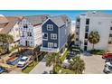 This raised beach house features convenient parking, green lawn and easy beach access at 1611B S Ocean Blvd., Surfside Beach, SC 29575