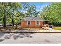 Exterior shot of a small home featuring a ramp, white shuttered windows, and street view at 1800 9Th Ave., Conway, SC 29527