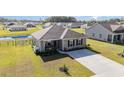 Well-kept single-story home with landscaped front yard, set in a neighborhood near a pond at 231 Jeff Waters Circle, Longs, SC 29568