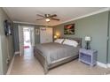 Inviting bedroom showcases stylish decor, tile flooring, and access to a balcony at 2406 N Ocean Blvd. # 803, Myrtle Beach, SC 29577