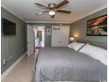 Well-lit bedroom boasts tiled flooring, a ceiling fan and ensuite kitchen access at 2406 N Ocean Blvd. # 803, Myrtle Beach, SC 29577