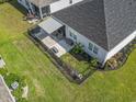 An aerial view showing a fenced-in backyard and patio with awning, perfect for outdoor entertaining at 3056 Skylar Dr., Myrtle Beach, SC 29577