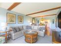 Inviting living room with comfortable seating and an open view to the kitchen and dining area at 311 71St Ave. N # 5A, Myrtle Beach, SC 29572