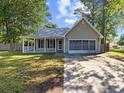 Charming single-story home with a welcoming front porch and screened in garage in a mature neighborhood at 314 Trace Run, Myrtle Beach, SC 29588