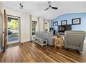 Bright living room with hardwood floors, vaulted ceiling, a ceiling fan, and a comfortable seating arrangement at 314 Trace Run, Myrtle Beach, SC 29588