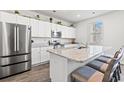 Bright kitchen featuring stainless steel appliances, white cabinets, and granite counters at 3968 Hibiscus Dr., Little River, SC 29566