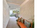 Bright hallway with a comfortable bench, decorative pillows, and a glimpse of the outdoors at 417 South Dunes Dr. # B16, Pawleys Island, SC 29585