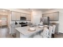 Modern kitchen featuring sleek cabinets, granite countertops, and stainless steel appliances for culinary enthusiasts at 418 Glade Ct., Loris, SC 29569