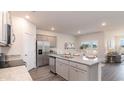 Open-concept kitchen featuring stainless appliances, granite counters, and an island perfect for casual dining at 418 Glade Ct., Loris, SC 29569