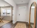 Bright entryway features wood-look floors and a view into a study with lots of light at 426 Glade Ct., Loris, SC 29569