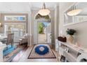 Bright foyer with tile flooring, decorative console table, and a view to the front yard at 4311 Grovecrest Circle, North Myrtle Beach, SC 29582