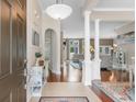 Inviting foyer with hardwood floors, decorative columns, and an open view to the living room at 4311 Grovecrest Circle, North Myrtle Beach, SC 29582