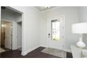 Clean entryway with hardwood floors, view of a tiled bathroom and a glass panel front door at 435 Clear Lake Dr., Conway, SC 29526