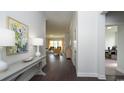 Inviting entryway boasting hardwood floors with views of the living room, with gray walls and white trim at 435 Clear Lake Dr., Conway, SC 29526
