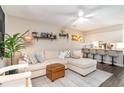Open living space with a sectional sofa, bar seating, and stylish decor at 4616 Lomax Ct. # 9-B, Murrells Inlet, SC 29576