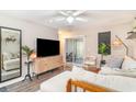 Bright living room featuring a TV, access to the patio, and contemporary decor at 4616 Lomax Ct. # 9-B, Murrells Inlet, SC 29576